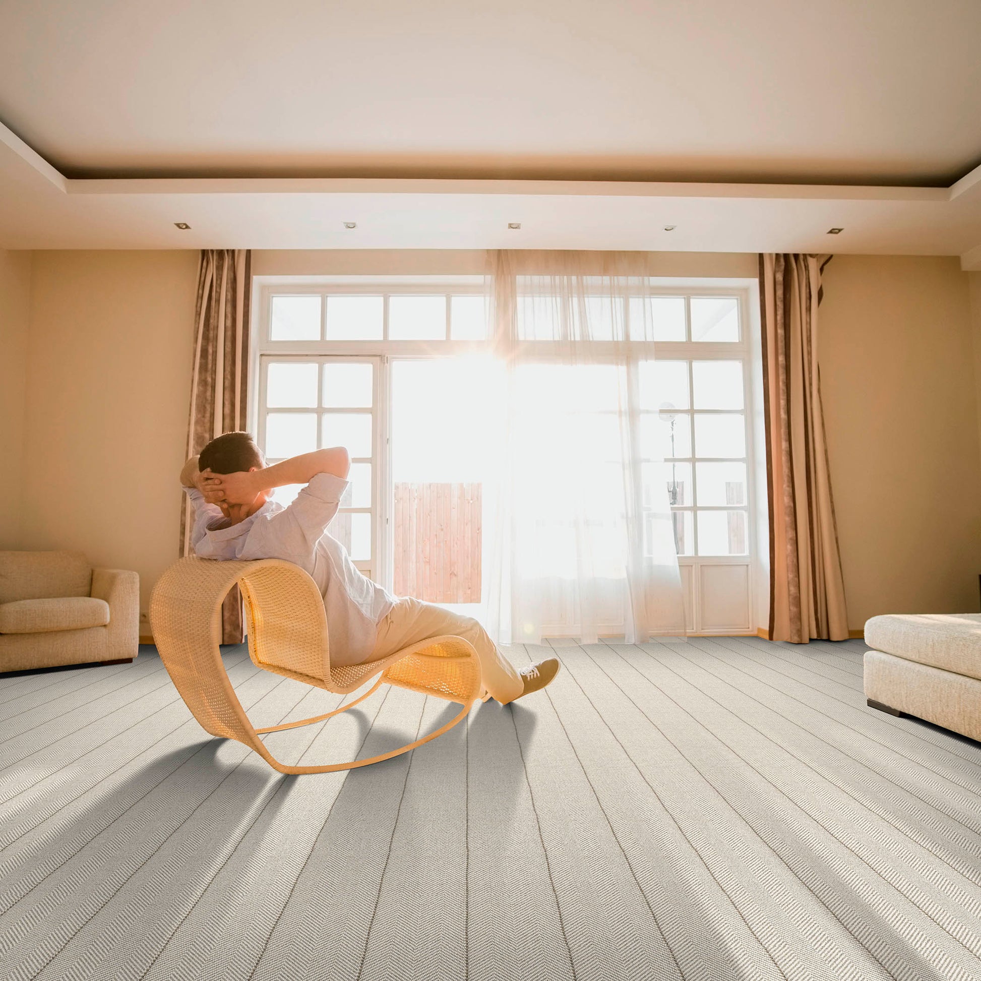 Peter island, a hand-loomed wool carpet with a chevron pattern and subtle stripe stitching in a living room