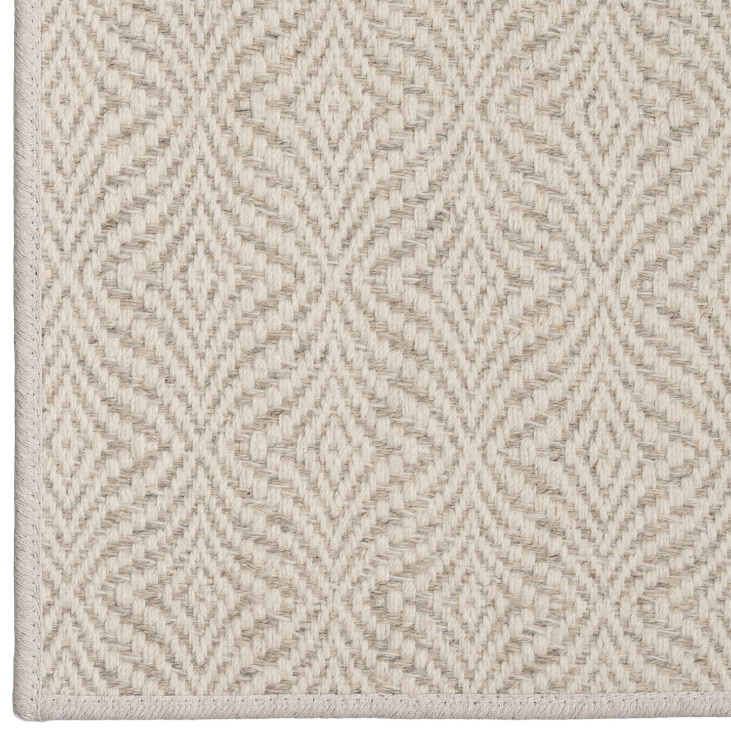 Textured beige carpet with a geometric pattern