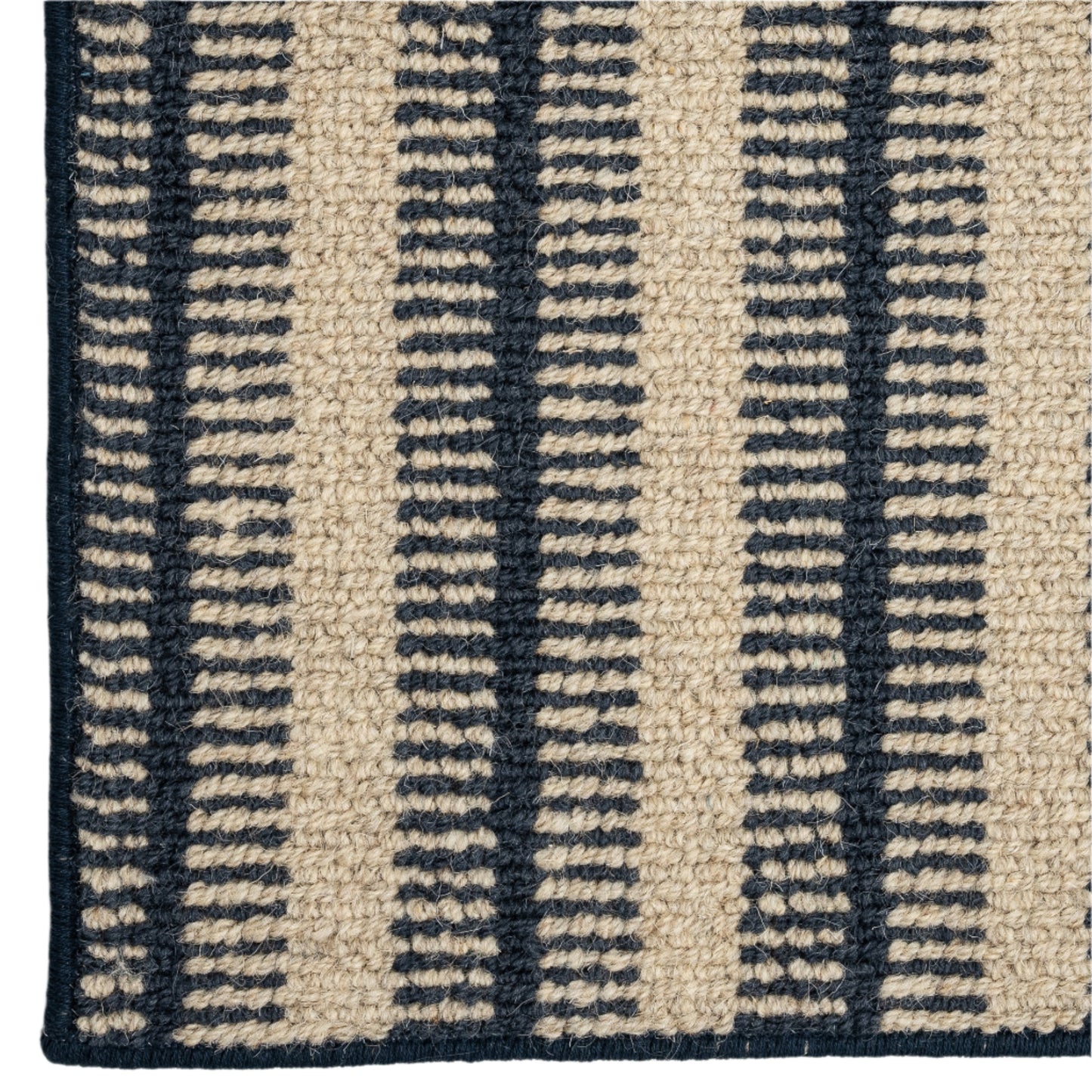 Close-up of a rug with blue and beige striped pattern