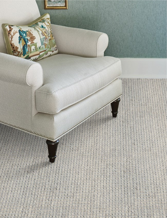 A room decorated with a luxury, modern rug from Home Carpet One, Tamil Chromium design