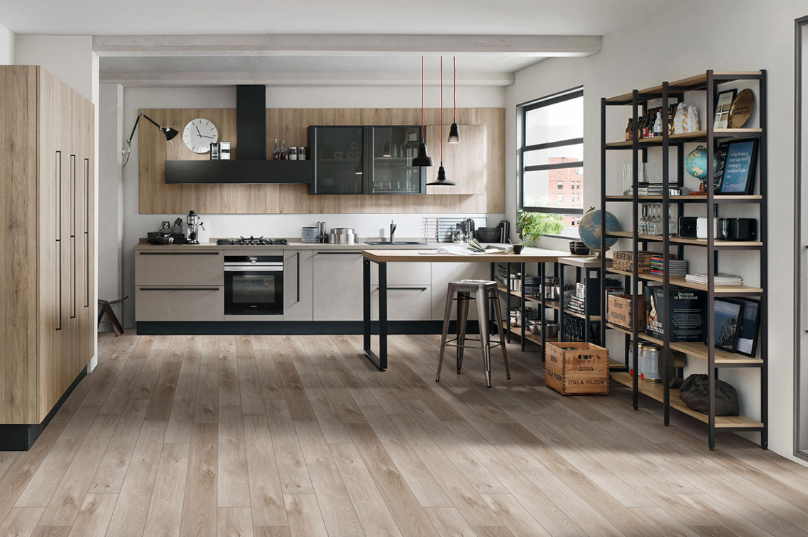 Modern kitchen with a hardwood flooring, vinyl countertops and tile walls.