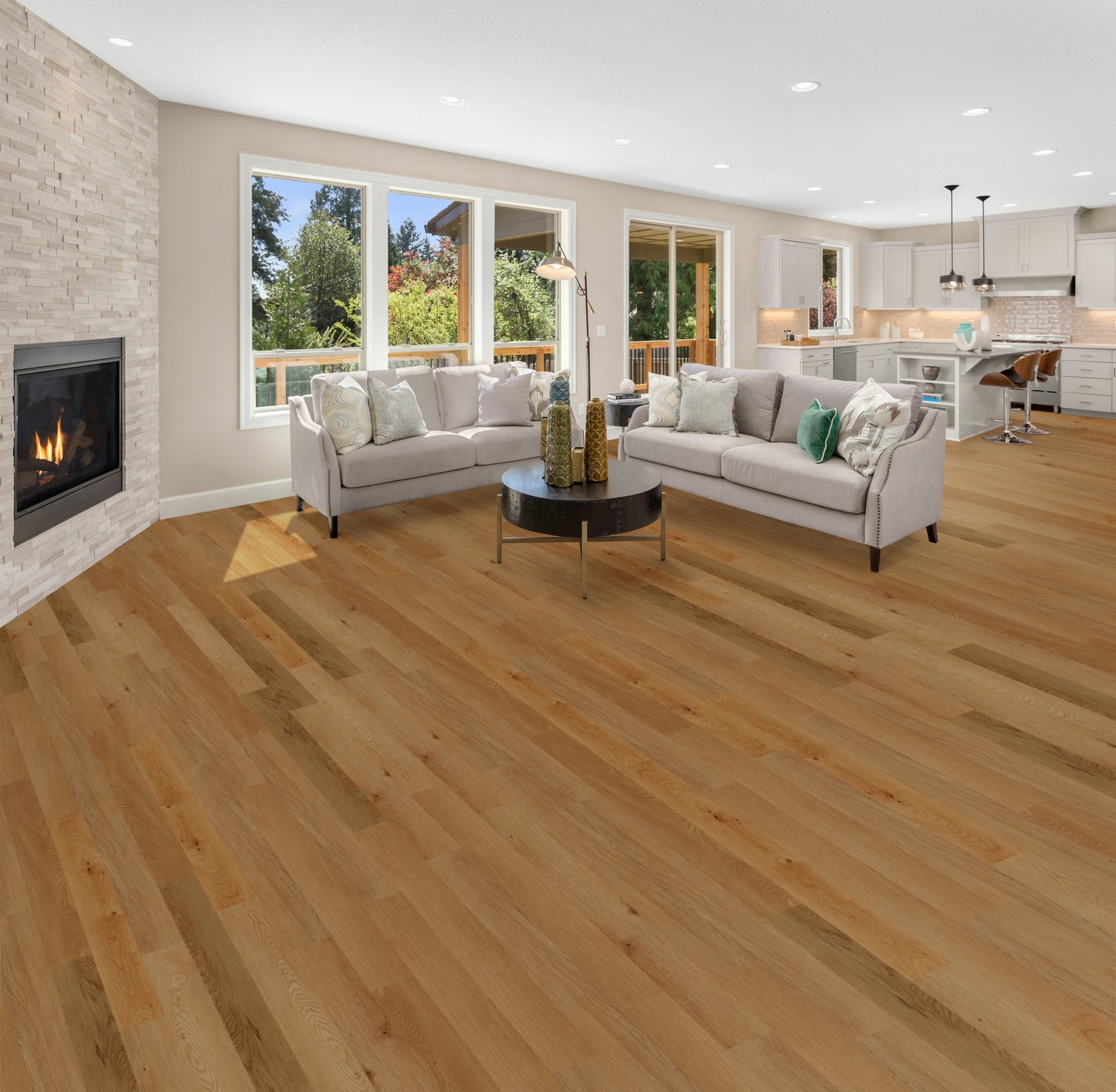 Nutmeg Vinyl flooring from Home Carpet One Chicago: Modern living room with white furniture and hardwood flooring in warm tones.