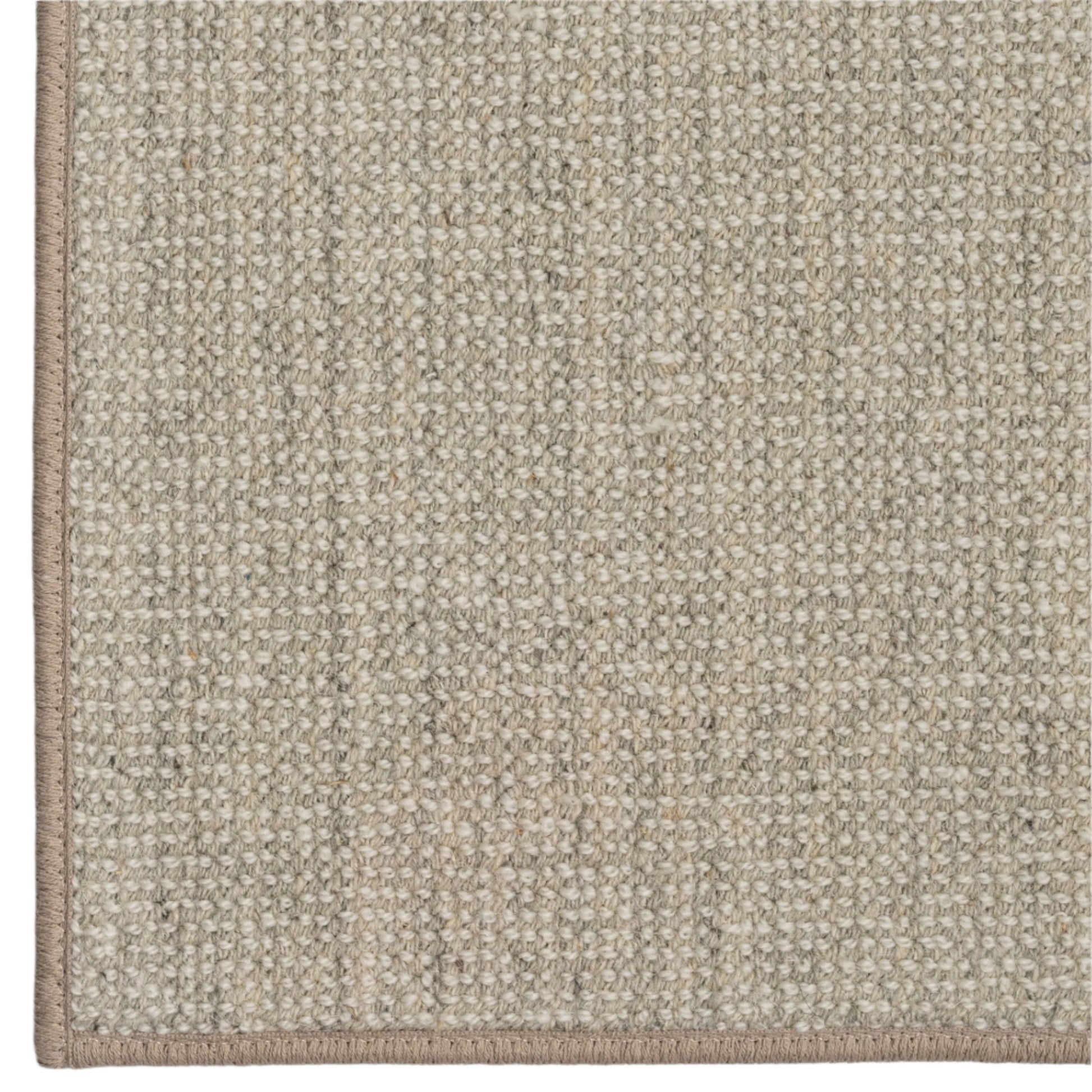 Close-up of a textured beige carpet