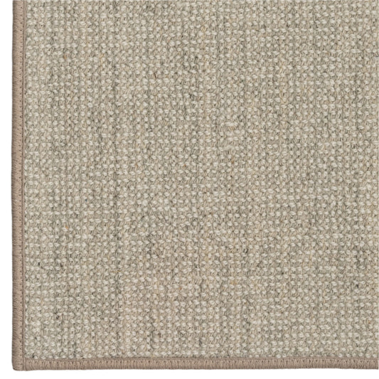 Close-up of a textured beige carpet