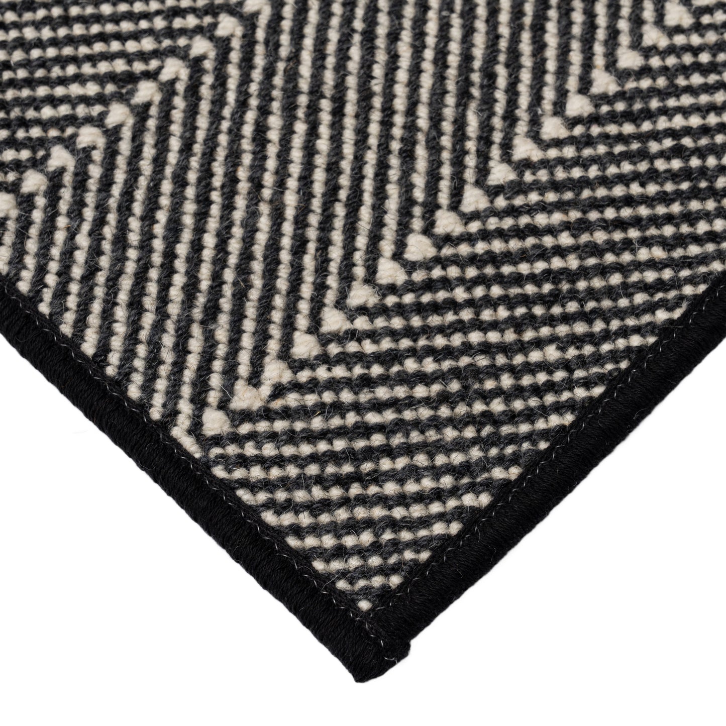 A wilton wool black and white carpet with a gorgeous black and white chevron pattern perfect for a living room rug, bedroom rug, office rug, or as a runner