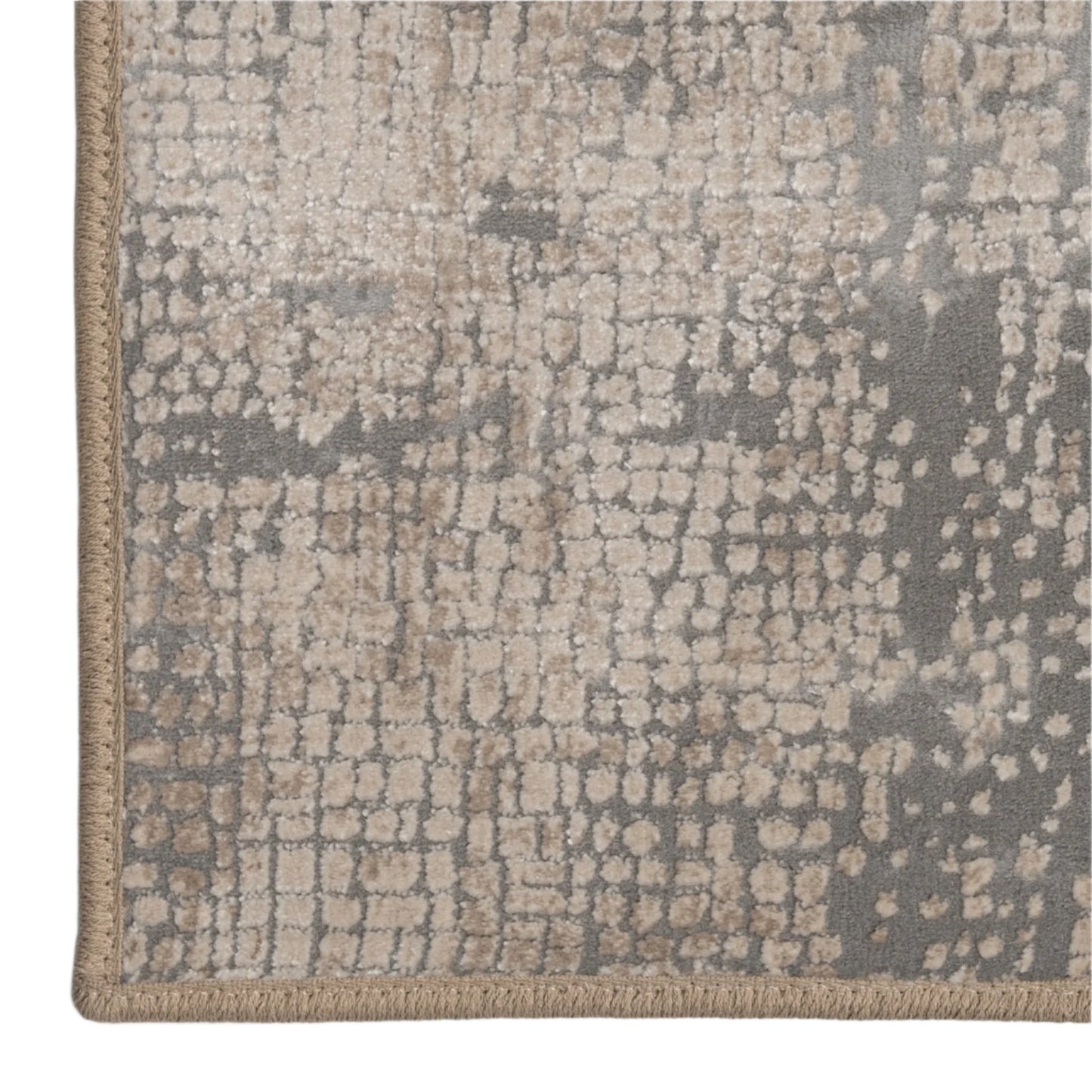 Close-up of a textured area rug with a neutral color palette on a light gray background.