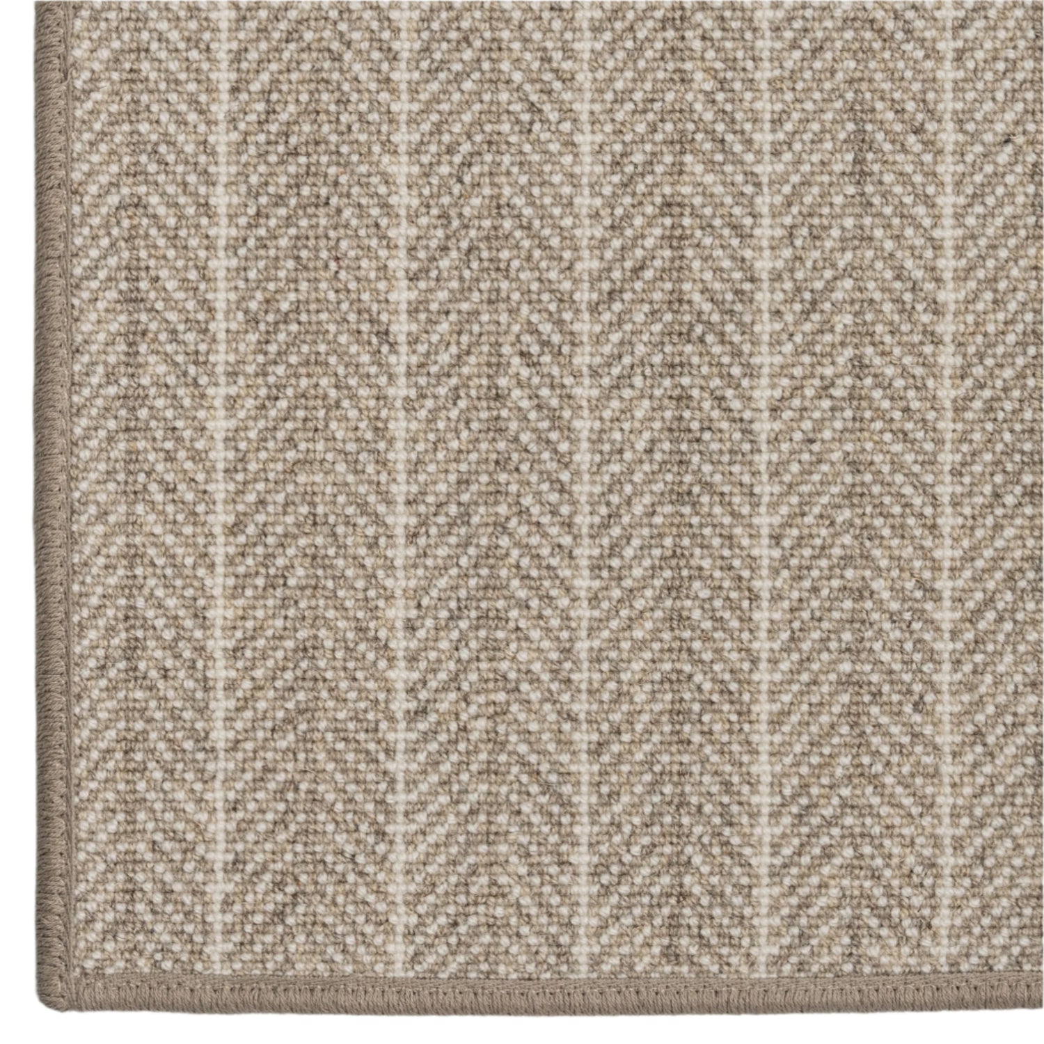 Close-up of a textured beige carpet with a subtle chevron pattern on a white background