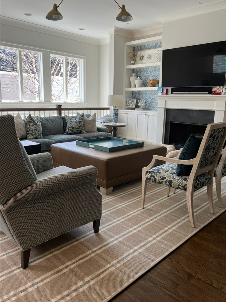 Carnoustie Plaid wool flatweave carpet in a cozy living room. 