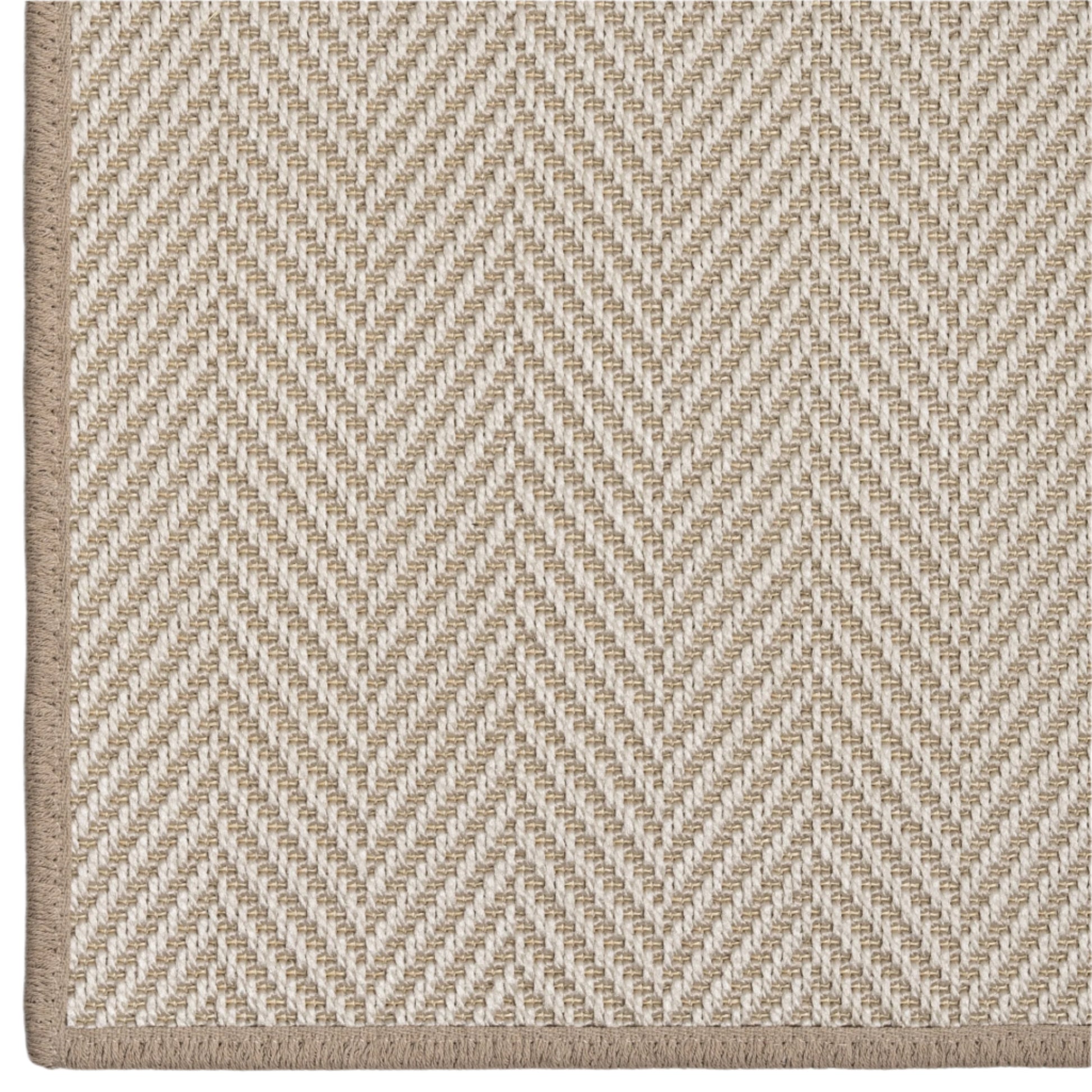 Close-up of a beige and white herringbone patterned rug.
