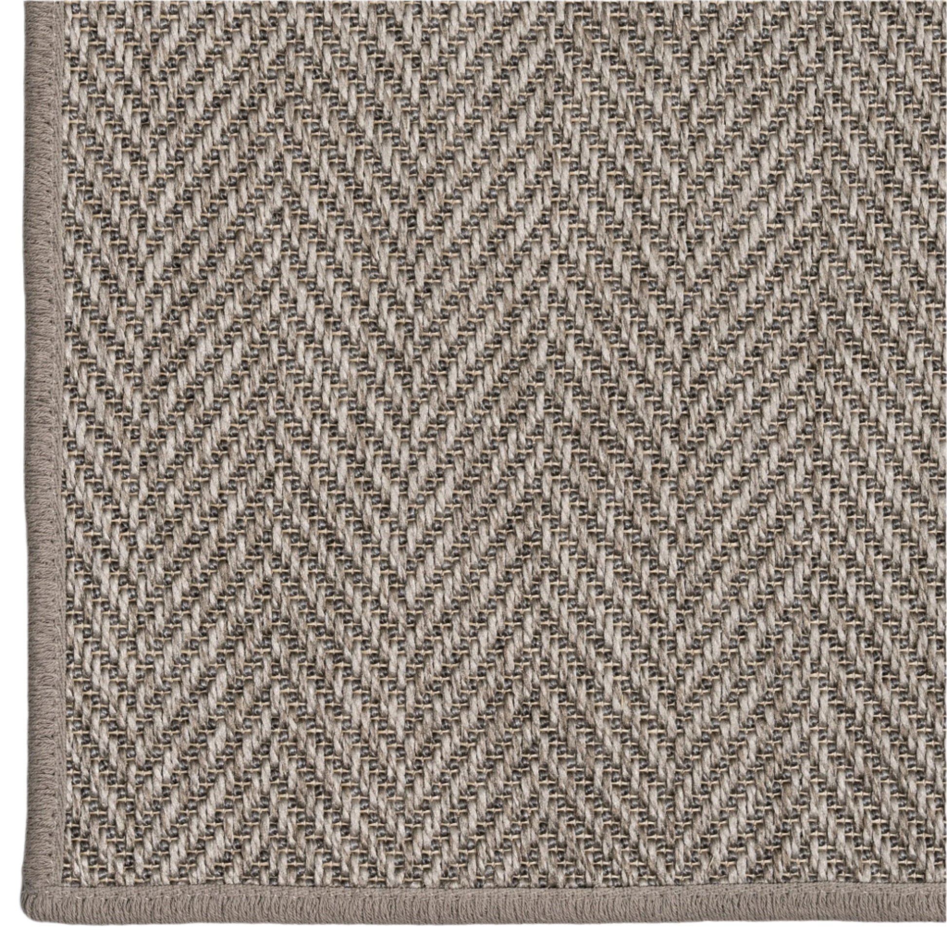 Close-up of a textured fabric with a herringbone pattern in neutral colors.