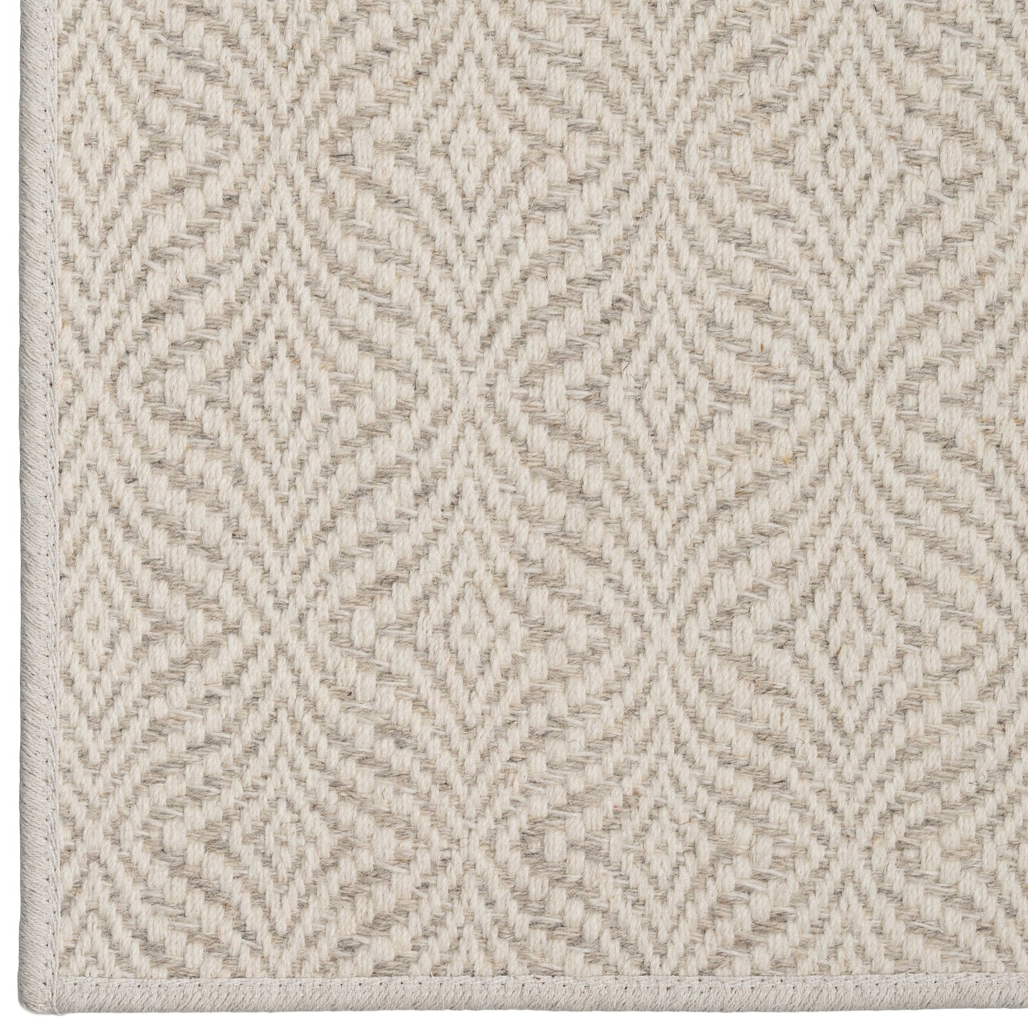 Textured beige carpet with a geometric pattern