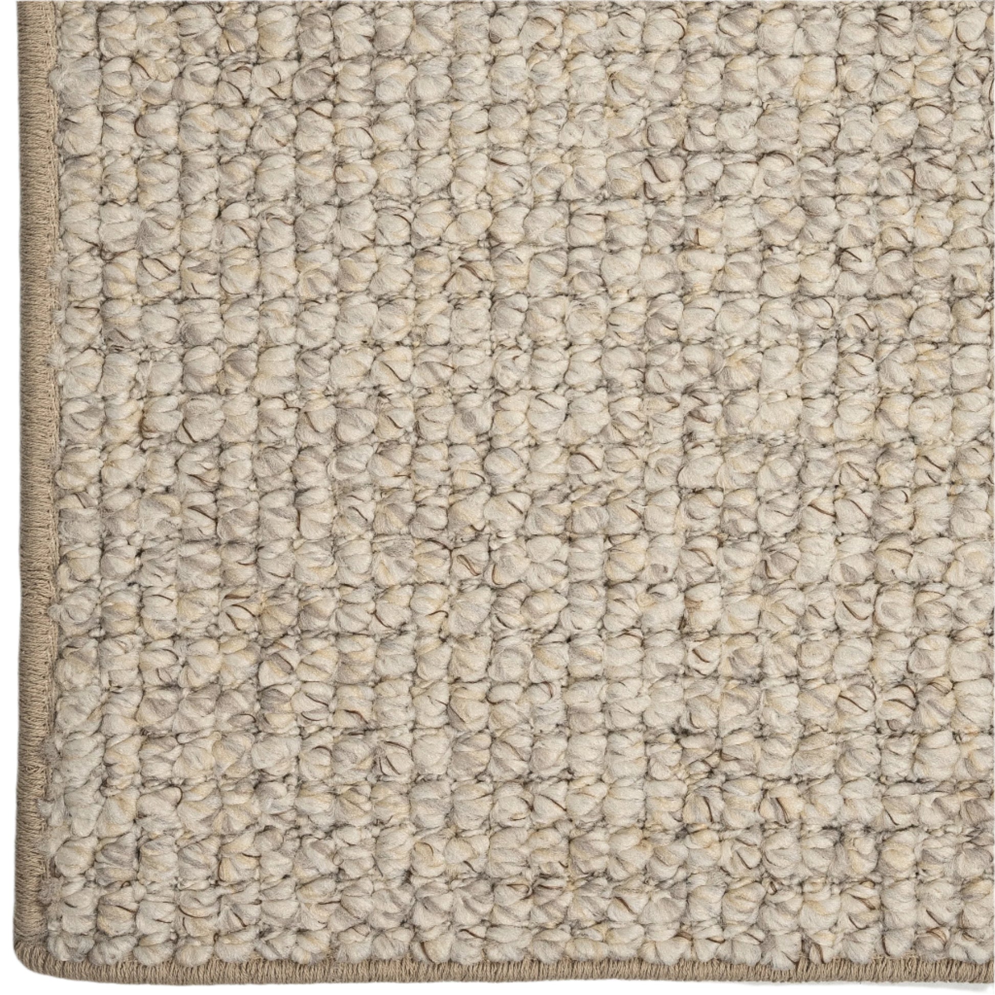 Close-up of a textured beige carpet