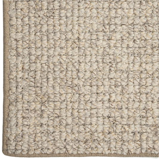 Close-up of a textured beige carpet