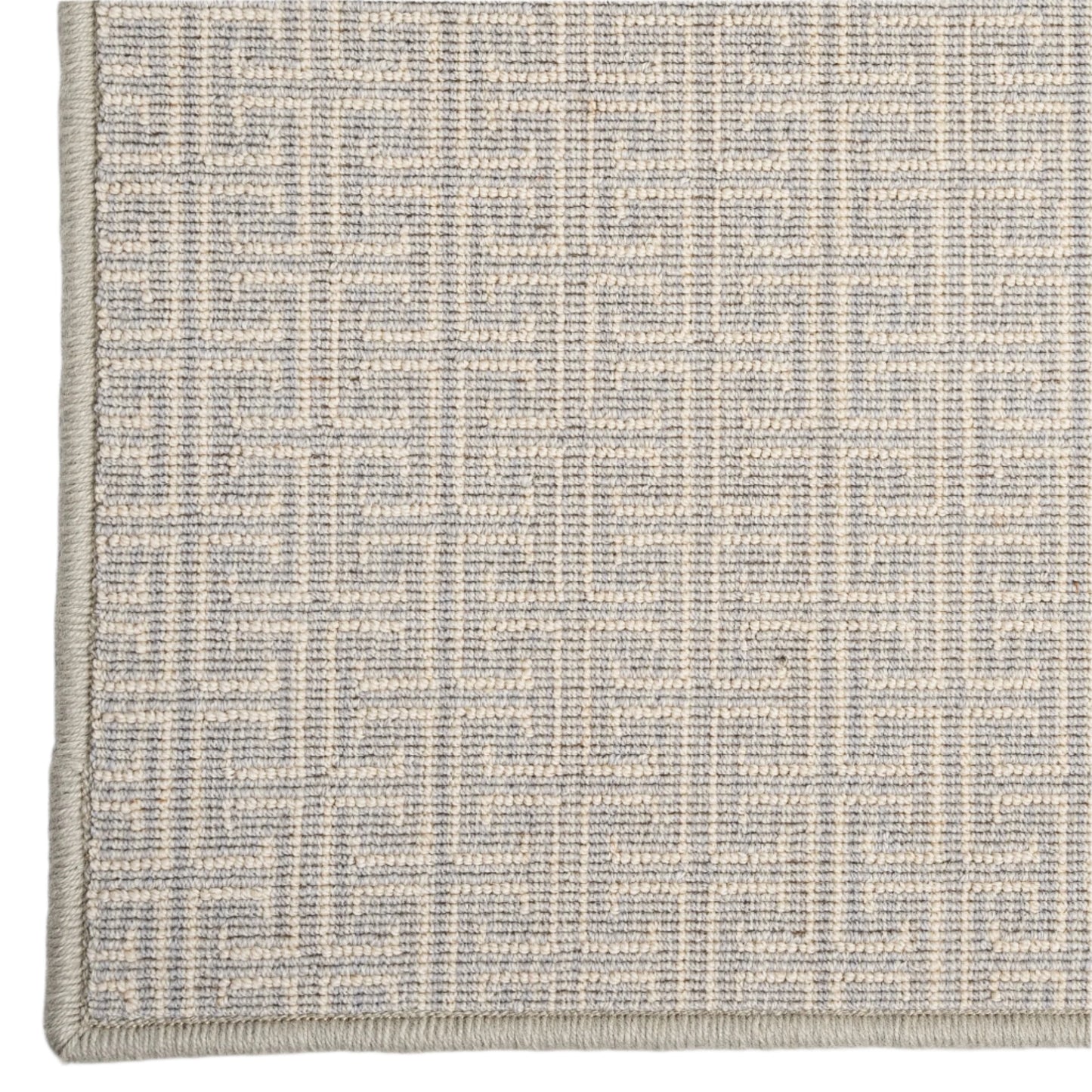 Textured gray and beige rug on a white background