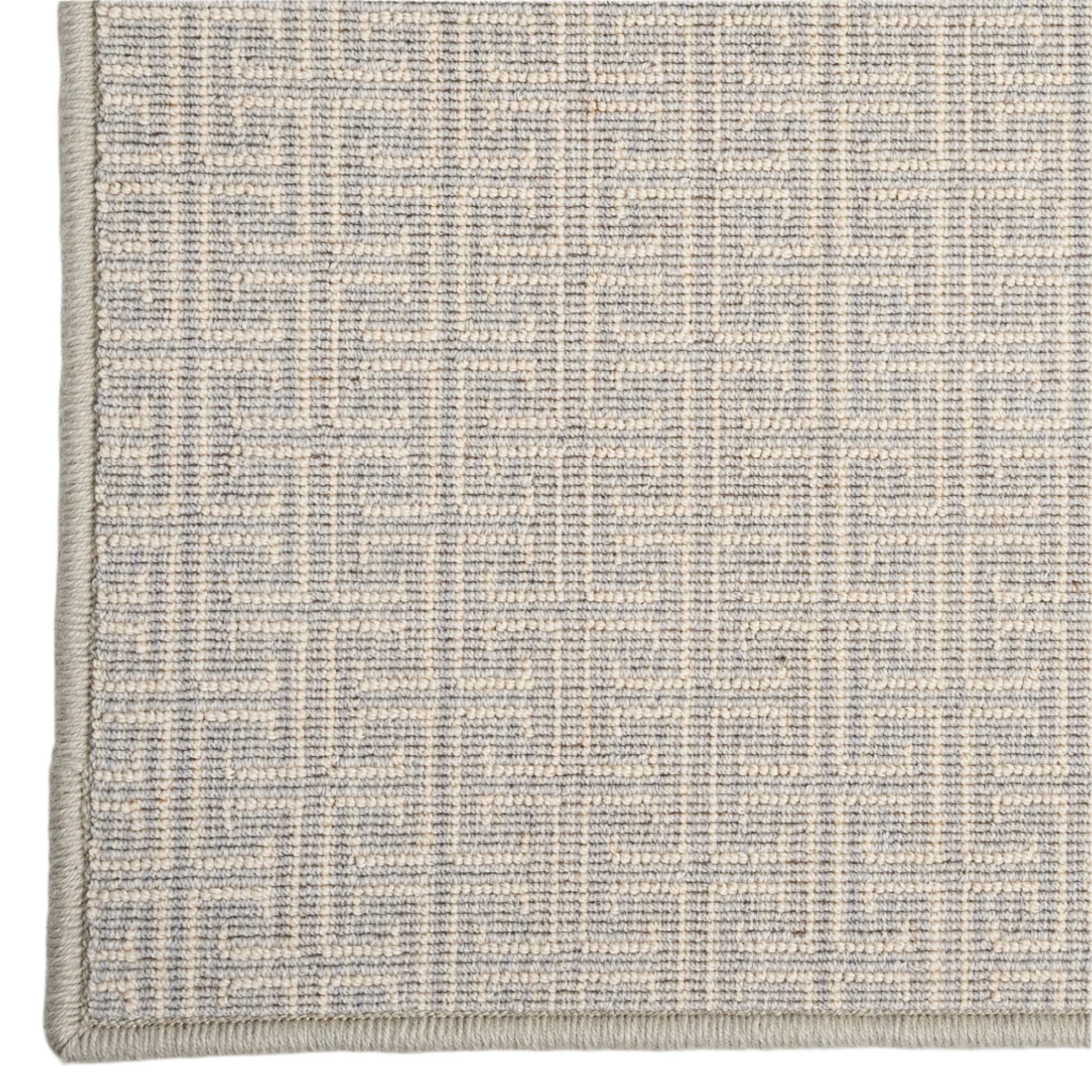 Textured gray and beige rug on a white background