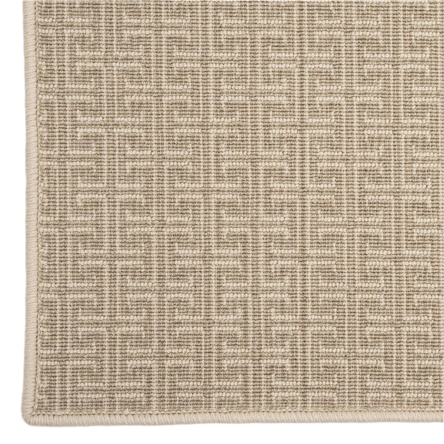 Textured beige rug with a subtle pattern on a light gray background